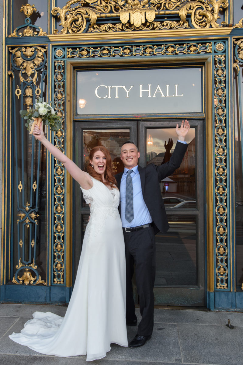 San Francisco City Hall Entrance with happy newlyweds